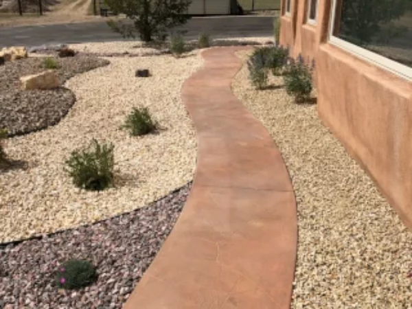 Adobe plantings rock landscape install