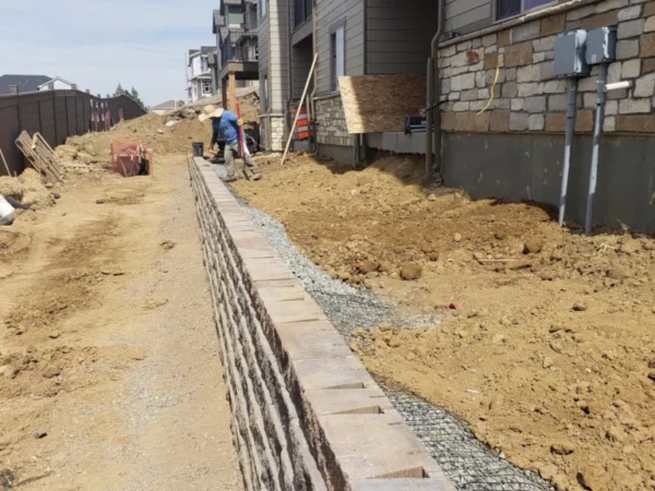 Block retaining geofrabric wall